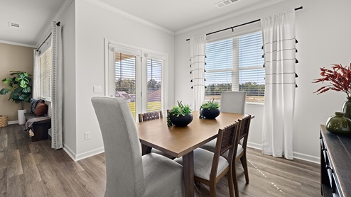booth dining room with access to the back patio