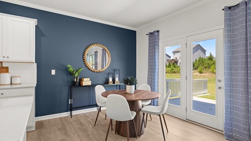 Interior dining area with accent wall and back patio doors