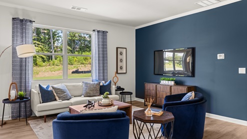 Interior living area with windows and accent wall