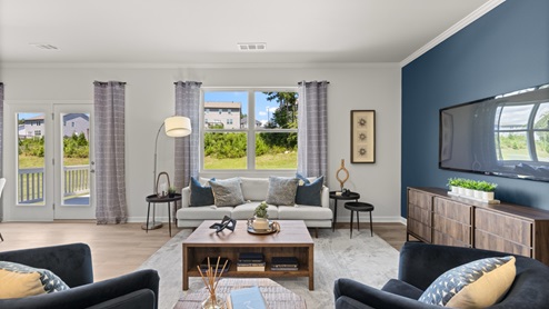 Interior living area with windows and accent wall