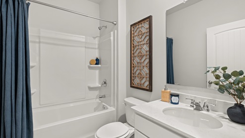 Interior bathroom with sink and full-sized shower