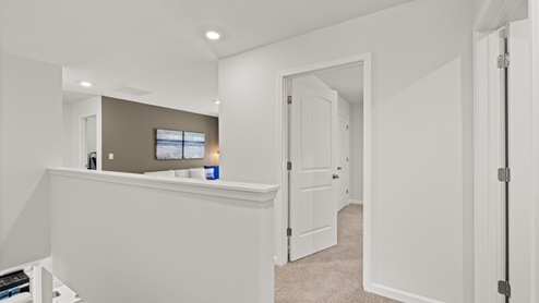 Interior upstairs loft area open to staircase
