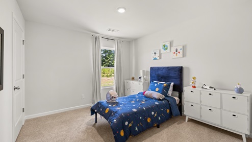 Interior bedroom with window and closet