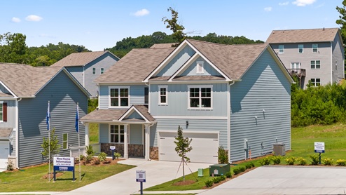 Exterior two-story home with stone detailing and cladding