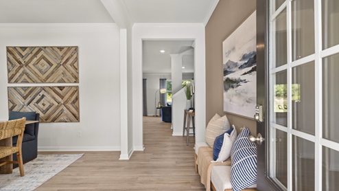 Interior entry-way next to flex room and leading to living area
