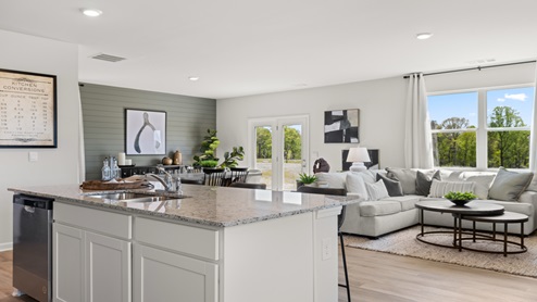 Our Rolling Meadows model home kitchen shares its bright layout, upgraded island, and full appliance package