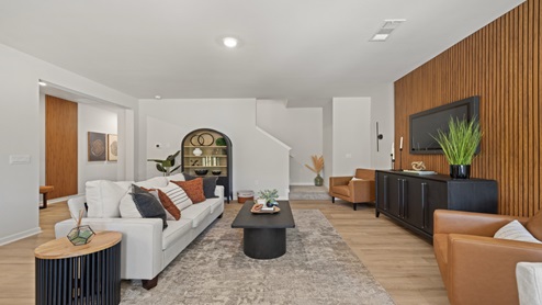 townhome model living room with hardwood flooring