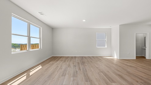 open concept living area with windows