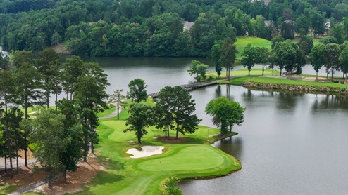 Aerial view of lush golf course near the community.
