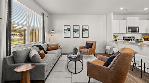 pearson model townhome open concept living room with a large window for natural light