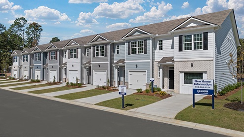 pearson townhome front exterior with brick end unit at old summerville village in rome georgia
