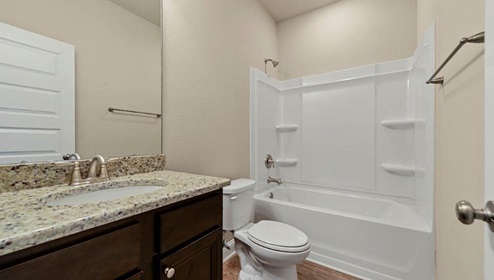 Guest bathroom with shower/tub combination.