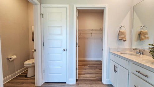 Ensuite with separate commode room and linen closet.