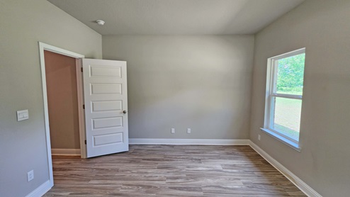Guest bedroom in a new home plan called The Emma.