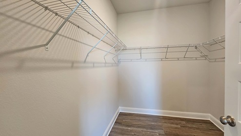 Large walk-in closet with wire shelving.