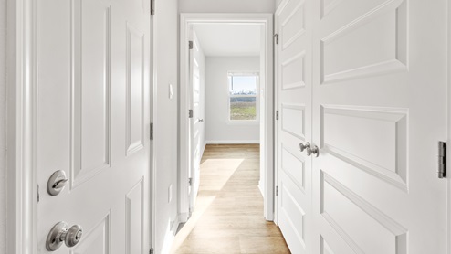 Spacious hallway into additional bedrooms