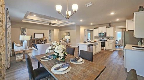 Open living, dining and kitchen area.