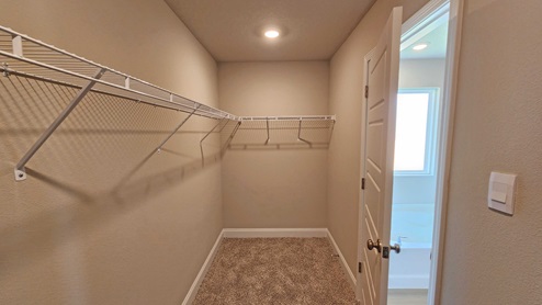 The Sawyer primary walk-in closet at Valor Ridge.
