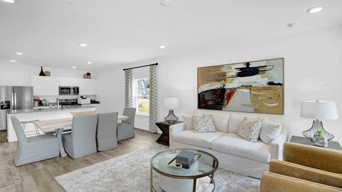 Spacious living room connected to the dining area with a window.