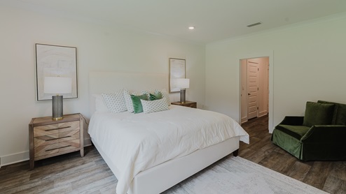 Spacious primary bedroom with en suite bathroom.