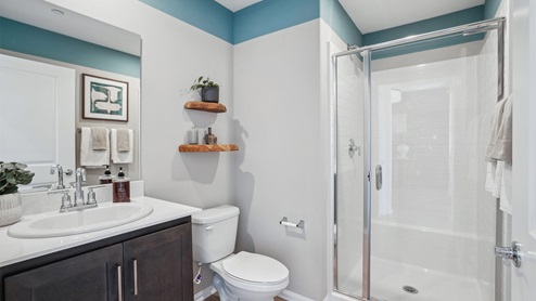 Secondary bathroom with vanity and shower
