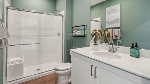 Secondary bathroom with vanity and shower