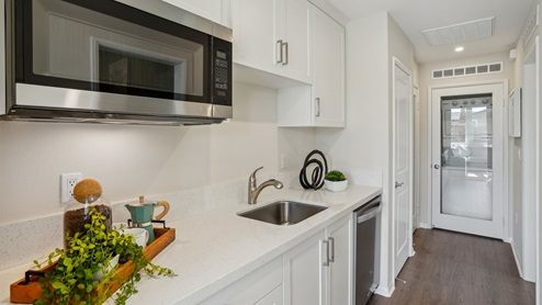 Multi-gen kitchenette with sink, microwave and mini refrigerator