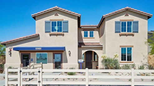Two-story Spanish home with shutters