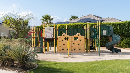 Community tot lot with playground equipment