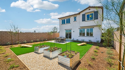 Spacious backyard with patio area and outdoor furniture