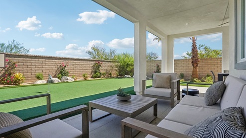 Covered California room with turf area