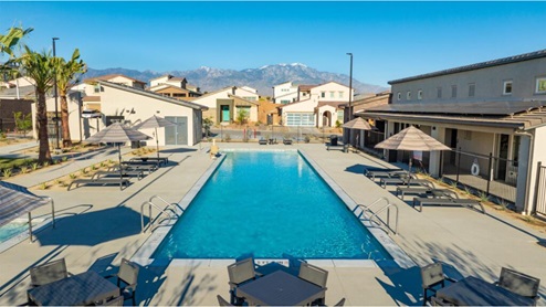 Community pool with lounge chairs