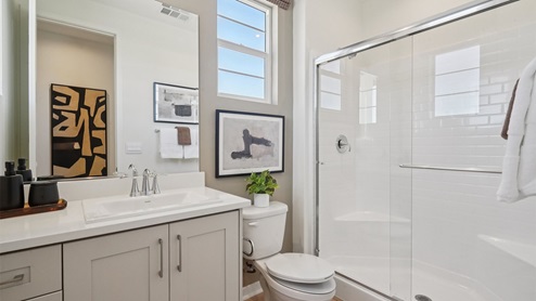 Secondary bathroom with vanity and shower