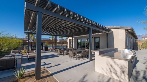Covered seating area and bbq at community recreation center