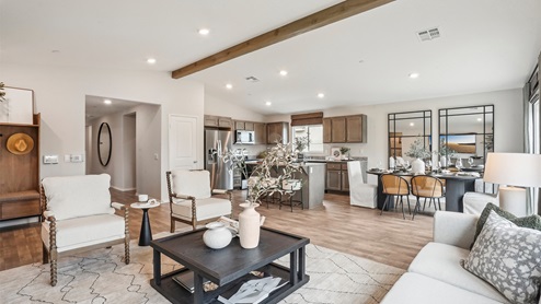 Open concept great room, dining, and kitchen space
