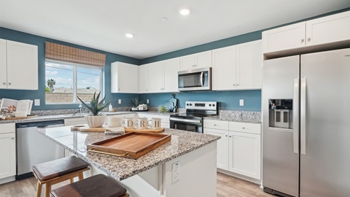 Kitchen with an island and stainless-steel appliances