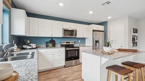 Kitchen with an island and stainless-steel appliances