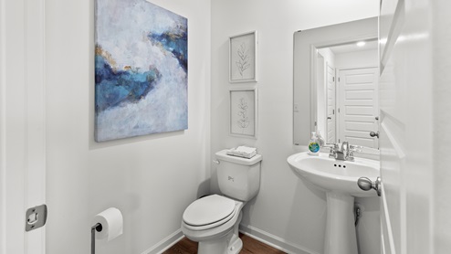Penwell – Primary Bathroom – 1 – A bathroom with two sinks and a plant, creating a refreshing and functional space.