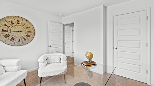 office lounge with white chairs and a glass desk