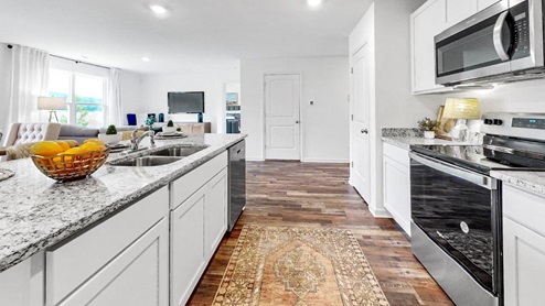 Freeport – Kitchen – 3 - A differnt angle of the kitchen that shows the large island and the pantry