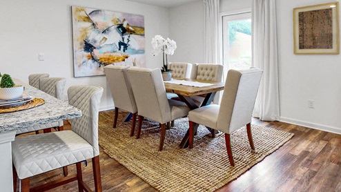 Freeport – Dining Room – 2 – Large dining area that holds a large kitchen table and 6 chairs that opens to the kitchen