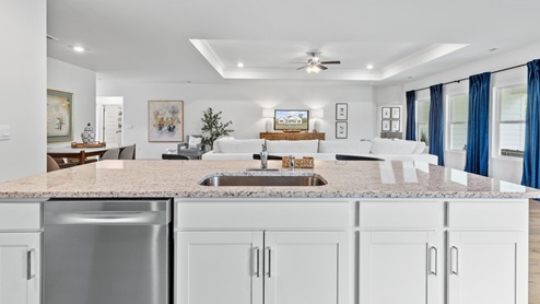 Welcome to the Destin Plan, a beautiful 4 bed, 3 bath home with a spacious covered patio and a 3-car garage – all on one level. Sitting just under 2,300square feet, this home offers a large breakfast nook, a separate dining area, and a large living area making a very comfortable open design for easy entertaining. In the kitchen, you will find a large island bar and a corner pantry. As you enter the home, you are met with an inviting open floor plan with direct access to your living, dining and kitchen areas, a full guest bathroom, and the 2nd and 3rd secondary bedrooms. Immediately on either side you will have access to your three-car garage, perfect for multiple vehicles, and storage. Privately tucked away in this area is also the additional 4th bedroom, ideal for guest stays or a private office. Opposite the back end of the home will be your spacious, luxurious primary bedroom with full access to a walk-in closet, a large primary bathroom hosting a double vanity, tub and a shower. Coming back to the center of the home, you will find the stunning open layout of the living area and beautiful kitchen. The kitchen includes granite countertops, stainless steel appliances, stylish shaker cabinetry, and a center island perfect for additional seating. With natural light and nearby covered patio access, the living and dining area are integrated perfectly to complete this relaxing atmosphere. Enjoy easy maintenance in your home with our luxury vinyl plank flooring. In addition to all the features and amenities our Destin Plan offers, each home is built with our Smart Home technology package, designed to bring the ease and convenience of life right to your fingertips. As a most popular favorite, this plan is ideal for any size family. Call to schedule your personal guided tour of the Destin today!
