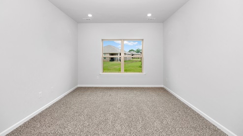 Primary bedroom with carpet