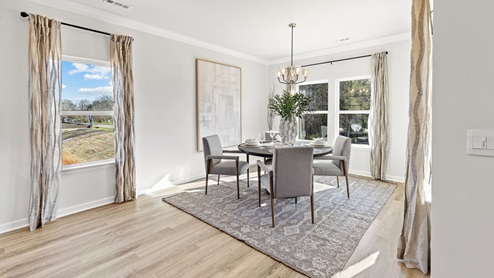 Dining room area with LVP flooring and windows