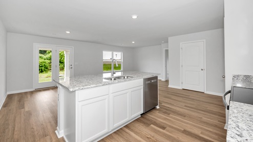 Kitchen island with view of dining / living room area