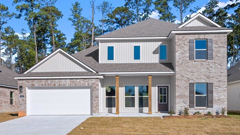 two-story home with brick and vinyl siding with two-car garage