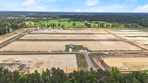aerial drone footage of rivers edge in progress building