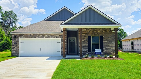 single-story home with gray brick and gray siding and patio and two-car garage