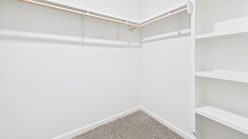 Shelvs and hanging rods in walk-in closet