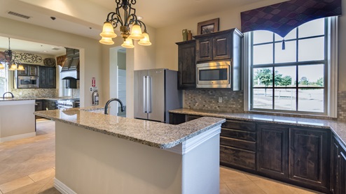 Amenity Kitchen with windows and a large island